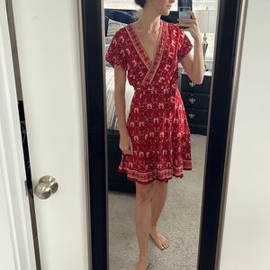 Red wrap around dress. New with tags. Never worn.